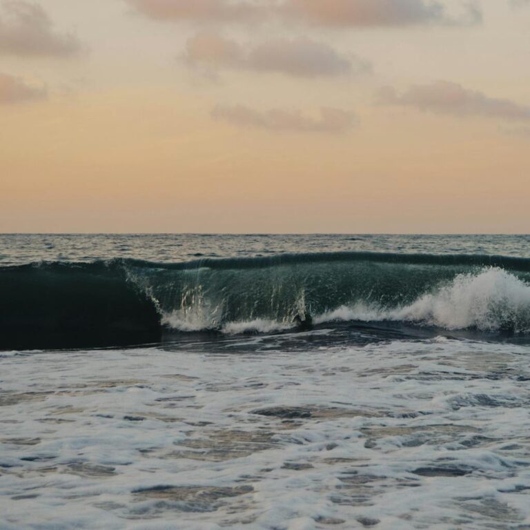 captivating sunset over sayulita beach mexico with crashing waves and colorful sky. 1508184 1024x1024.jpg